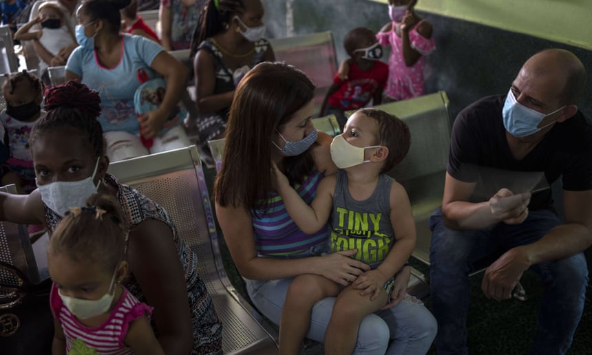 Parents wait to have their children vaccinated with the Soberana-02 Covid-19 vaccine, at a clinic in Havana in September 2021. Photograph: Ramón Espinosa/AP