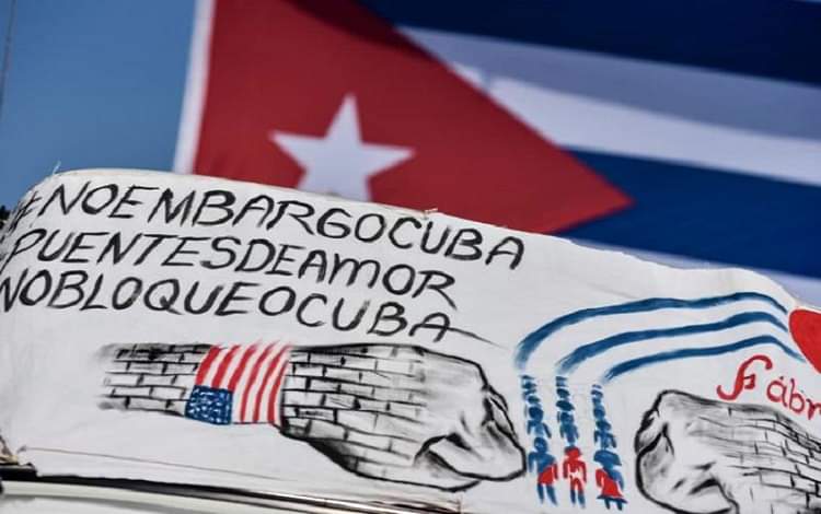 Protestor in solidarity with Cuba. End the US BLOCKAGE AGAINST CUBA