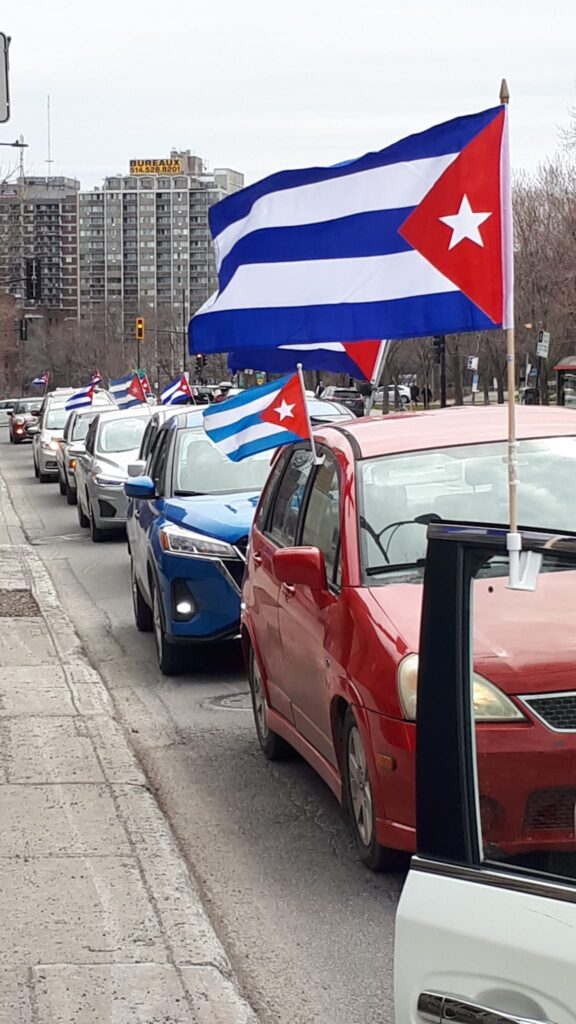 Protestor in solidarity with Cuba. End the US BLOCKAGE AGAINST CUBA