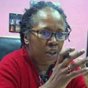 Black female lawyer wearing eyeglasses and red blouse