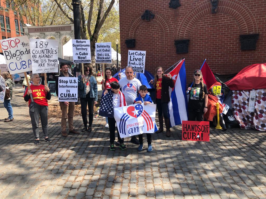 Protestor in solidarity with Cuba. End the US BLOCKAGE AGAINST CUBA